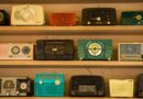 black radio on brown wooden shelf