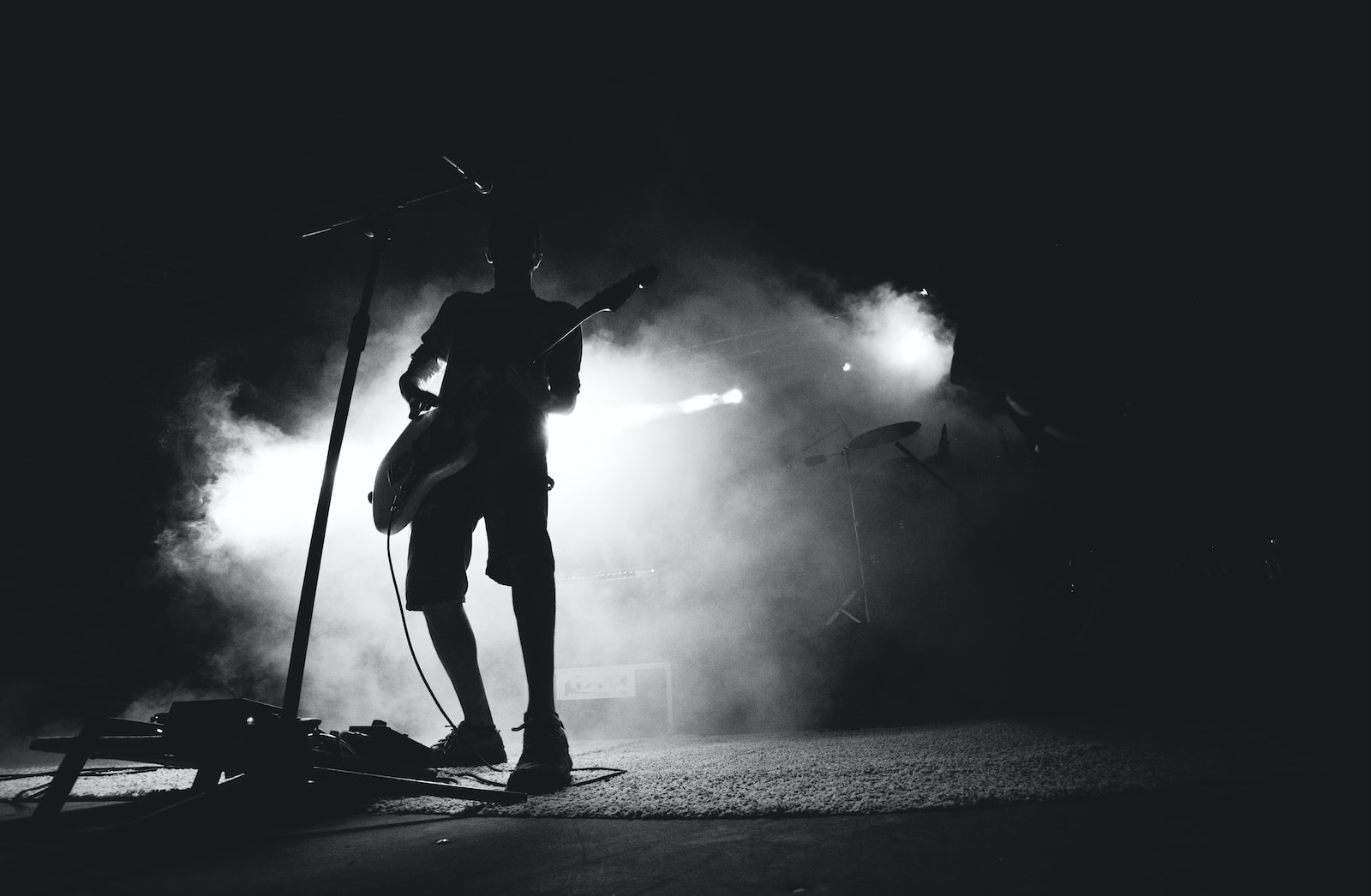 silhouette photo of guitarist